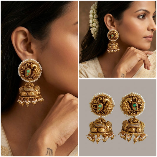 The Mayura Temple Jhumka: Regal Peacock Heritage with Pearl Border Divine Splendor: Handcrafted Nakshi Work Peacock Antique Gold & Emerald Earrings